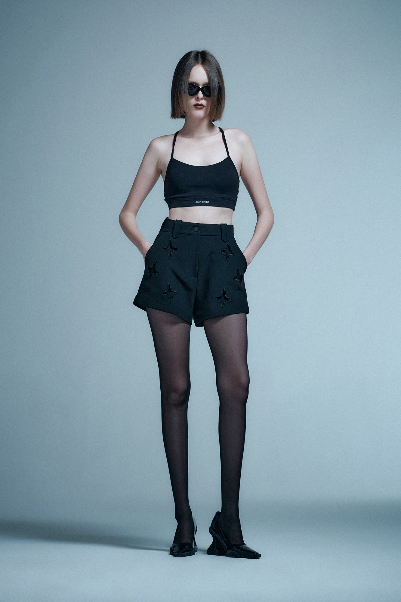 Acetic acid four-star hollow waist shorts