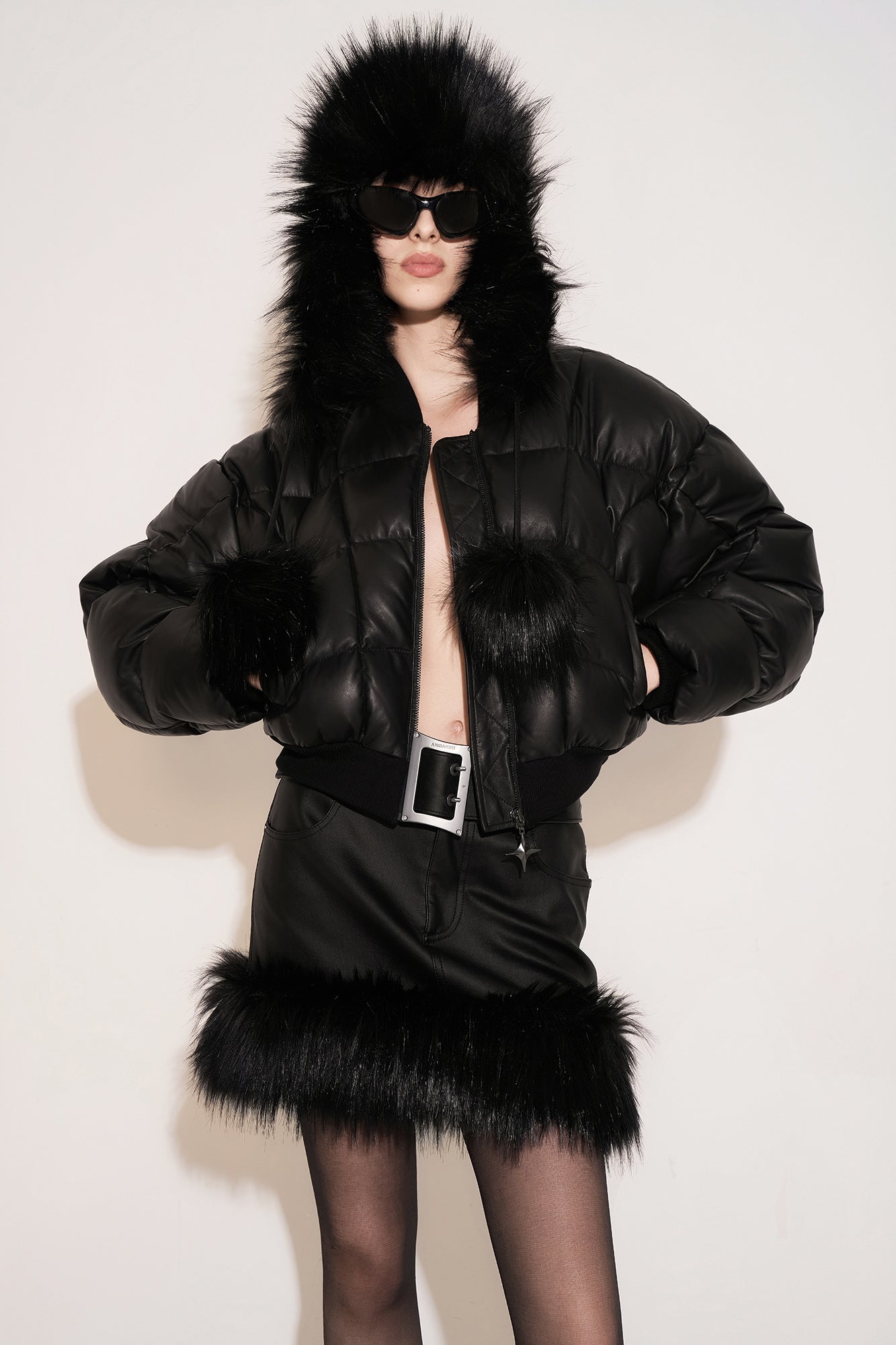 Leather quilted goose down jacket with wavy sleeves