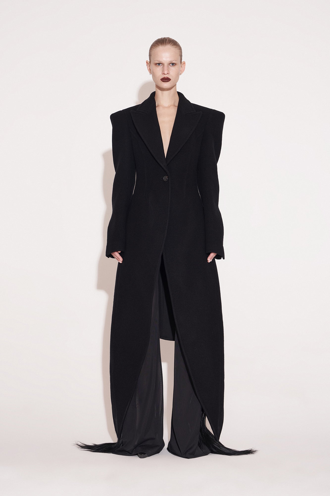 Wool coat with wide shoulders and swallowtail hem