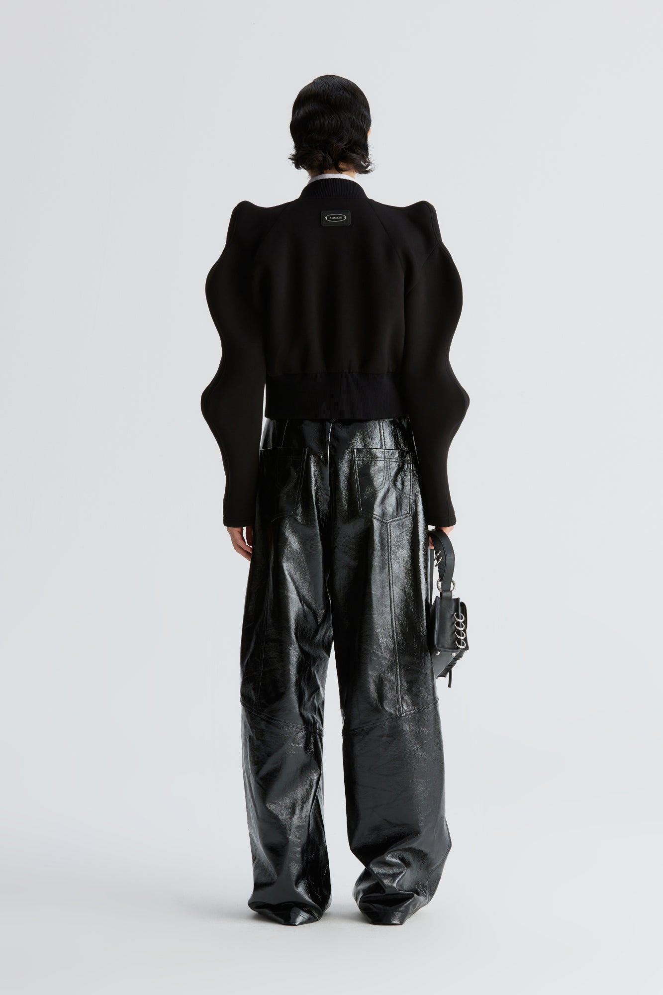 Three-dimensional upturned shoulder wavy sleeve waist-cinching coat