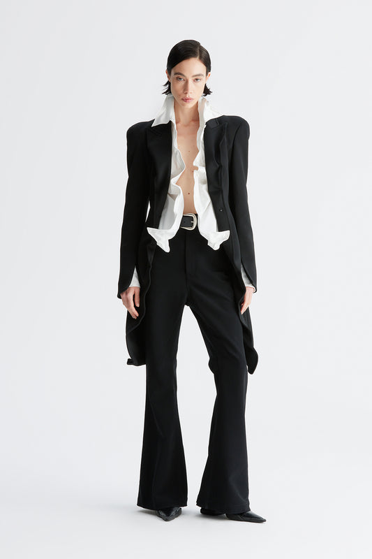 A round-shouldered suit with a swallow-tail hem