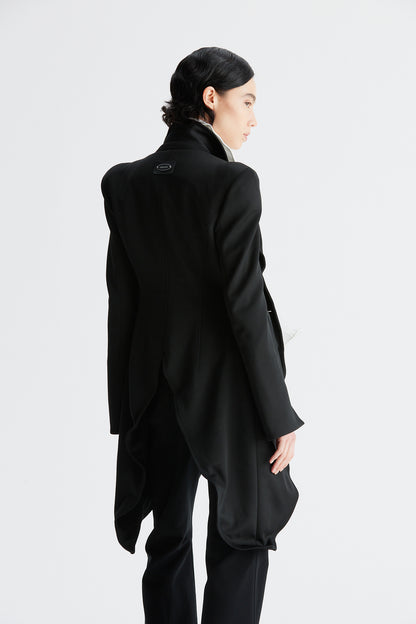 A round-shouldered suit with a swallow-tail hem